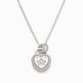 A silver heart-shaped pendant necklace with a small heart and sun motif in the center, surrounded by a border of tiny clear stones, hanging from a delicate silver chain against a light off-white background.