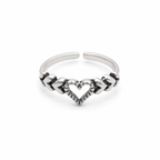 A silver adjustable toe ring featuring a central heart design with textured details and small dark accents, set against a plain white background.