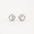 A pair of silver-toned butterfly stud earrings with a delicate border of small clear stones, displayed on a clean white background.
