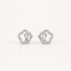 A pair of silver-toned butterfly stud earrings with a delicate border of small clear stones, displayed on a clean white background.