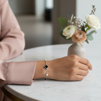 Bracelet styled with a modern blush-pink silk blouse