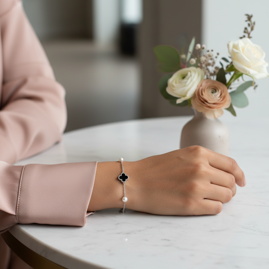 Bracelet styled with a modern blush-pink silk blouse