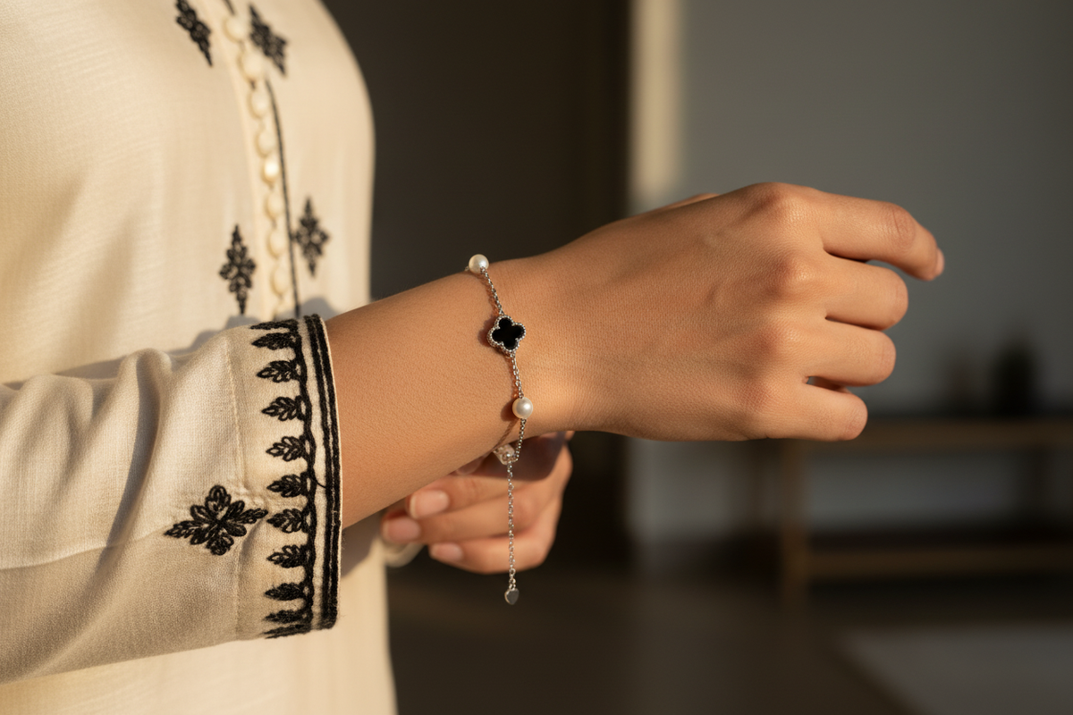 Bracelet worn with an ivory and black embroidered kurta