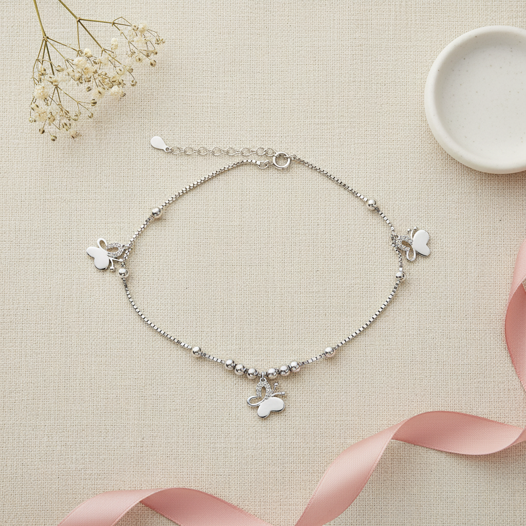 Elegant Butterfly Anklet — Flat Lay Cream Linen