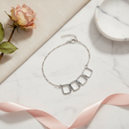 Geometric Square Sterling Silver Anklet editorial flat lay with rose and marble - elegant jewellery styling