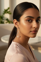 S-Curve Pearl Earrings — Model 2, Café Lifestyle