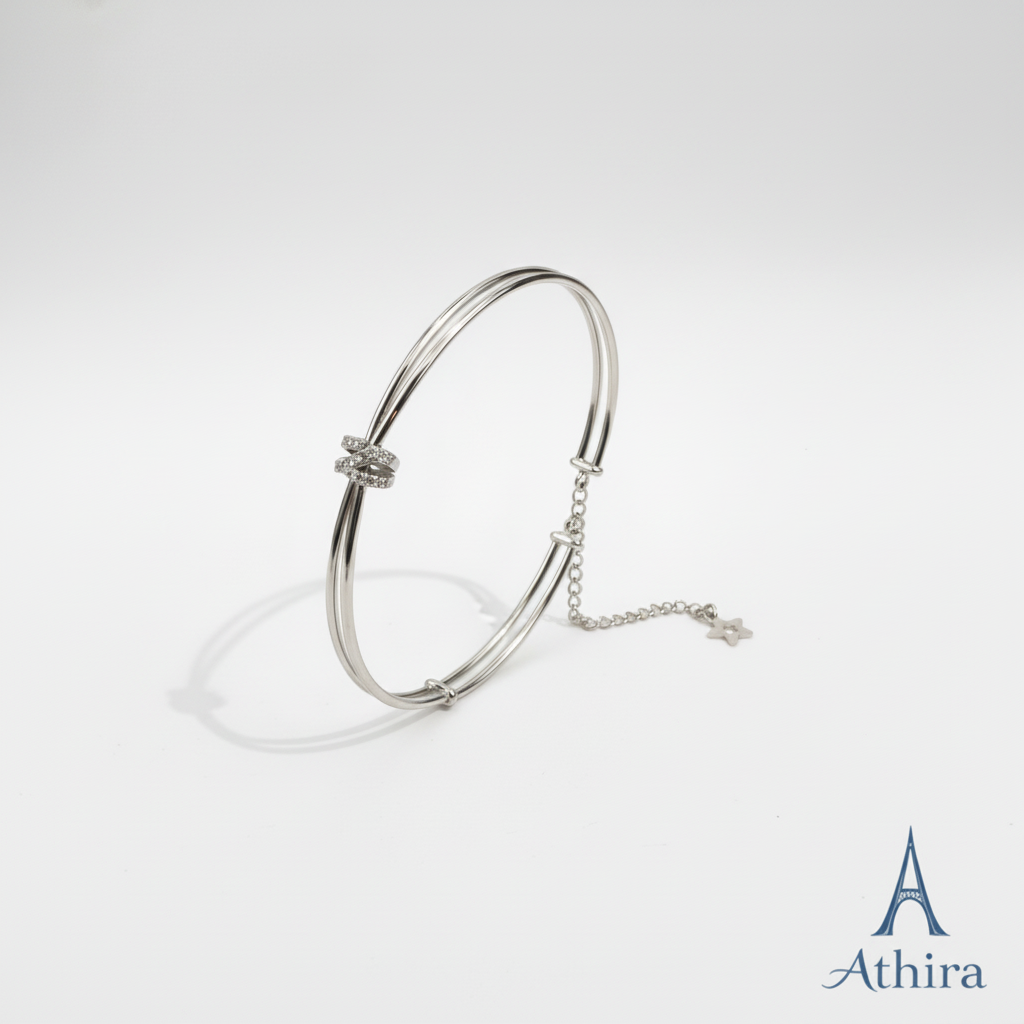 Silver kada on white background with Athira branding