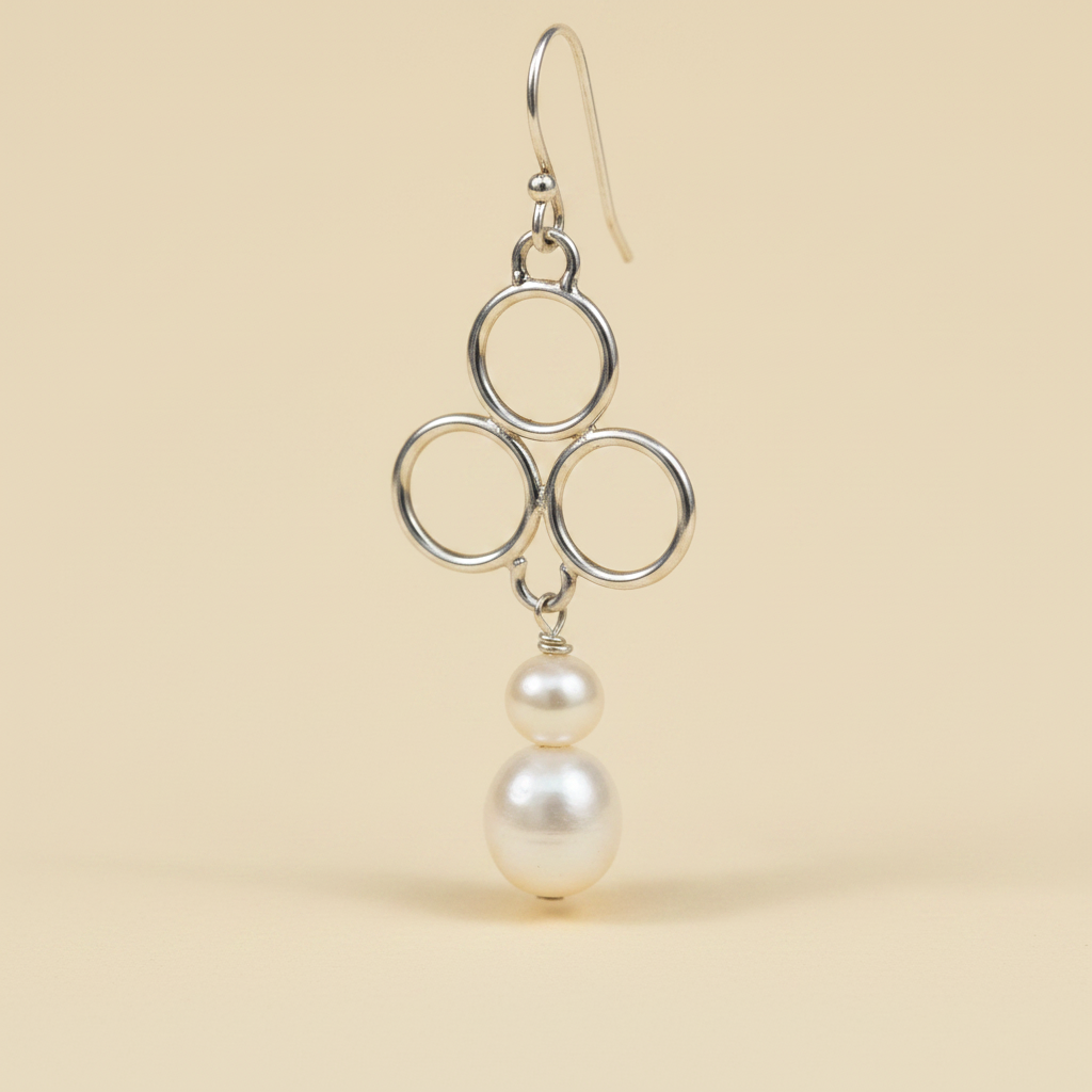 Sterling Silver Triple Circle Pearl Drop Earrings — Cream Background